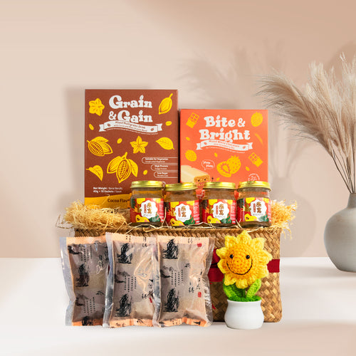 Pamper Snacktime Gift Basket featuring Bird's Nest, Bazhen essence, Bite & Bright collagen bars, and a crochet sunflower.